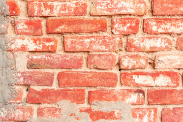 Texture of a brick wall with cracks and scratches which can be used as a background