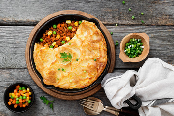 Shepherd's pie, traditional British dish with minced meat, vegetables and mashed potatoes.