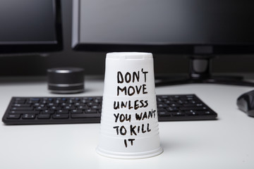 Message On Disposable Glass Over Desk