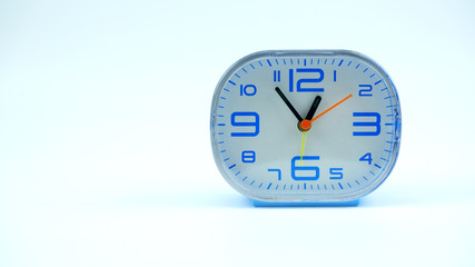 Blue Alarm clock face beginning of time 12.54 on white background, Copy space for your text, Time concept..