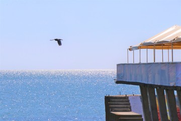 Panoramic view of the Black sea coast, located in Odessa, Ukraine. In the foreground a wooden...