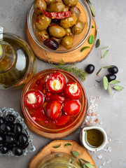 Italian food with Olives, Olive Oil, Cheese on concrete background copy space