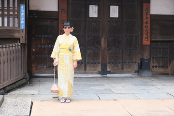Fototapeta na wymiar woman with kimono wearing glasses