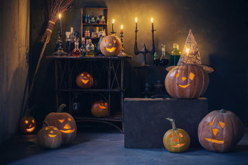 Halloween decoration with pumpkins and magic potions indoor