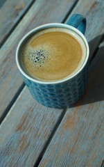 close up cup of coffee on wooden table
