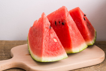 Slices of watermelon on wooden table, Closeup