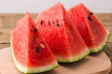 Slices of watermelon on wooden table, Closeup