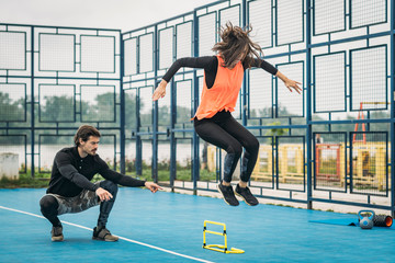 Obraz na płótnie Canvas Jumping Training with Personal Fitness Trainer