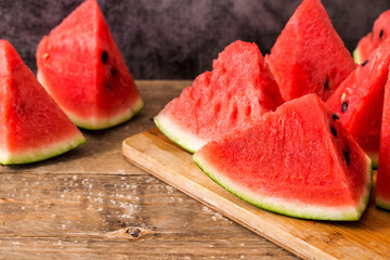 Slices of watermelon on wooden table