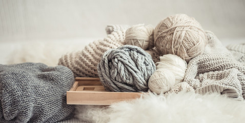 Fototapeta na wymiar cozy background Wallpaper with the yarn for knitting.