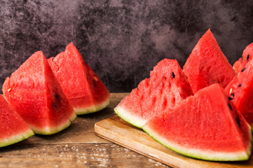 Slices of watermelon on wooden table