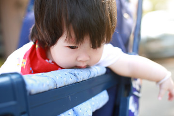 Cute asian Baby in a stroller