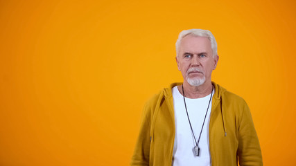 Sport trainer with whistle attentively watching match, team showing bad results