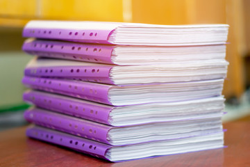 pile of documents on a wooden table. paperwork. data archive. office work