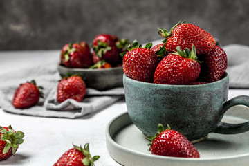 Soft focus of fresh ripe red strawberry in ceramic bowl
