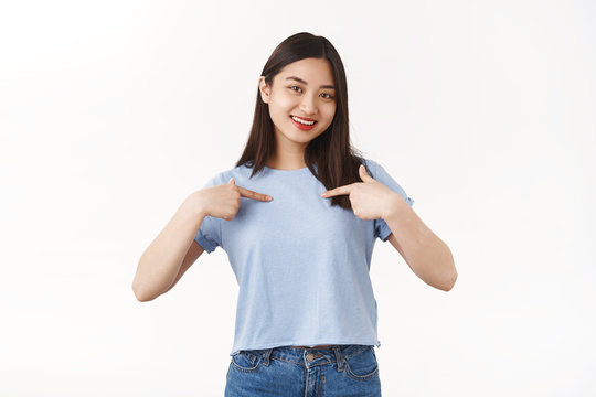 Me best candidate. Self-assured pretty asian brunette girl volunteering pointing herself boastful smiling delighted telling herself bragging own achievements wanna be picked chosen