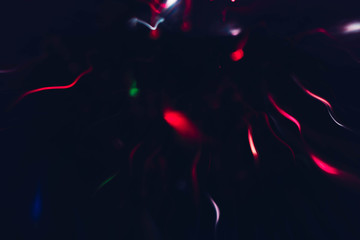 Blur neon magenta sparks. Defocused illuminated wavy lines. Dark abstract art background.