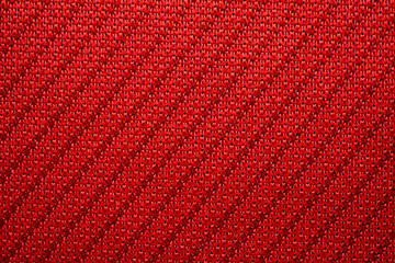 Red sports clothing fabric football jersey texture close up