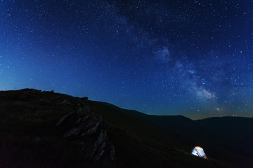 Fototapeta na wymiar Night photos in the Ukrainian Carpathian Mountains with a bright starry sky and the Milky Way