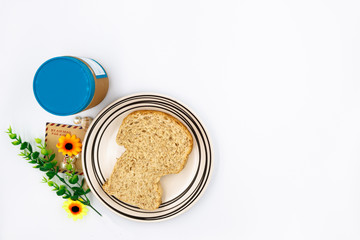 whole whet and peanut butter on white background