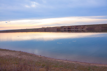 scenery with calm lake in the evening