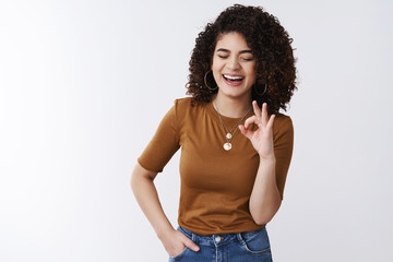 That was excellent. Happy funny carefree curly hair european girl laughing joyfully approve awesome...