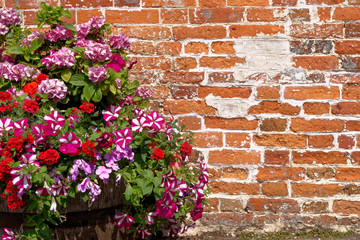 Fototapeta na wymiar Vivtage brick wall texture background with flowers