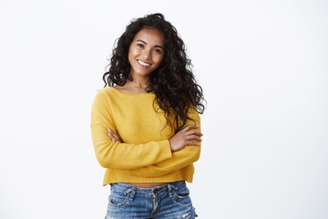 Happiness, wellbeing and confidence concept. Cheerful attractive african american woman curly...