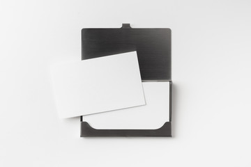 top view of business card with case on white