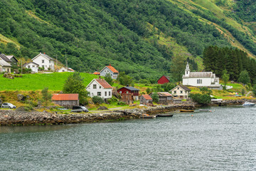 Rural houses in mountain village landscape, Norway, Sognefjord coast.