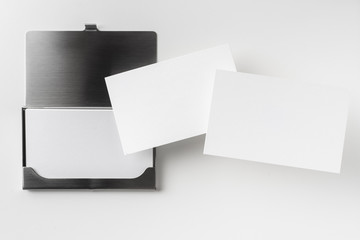 top view of business card with case on white