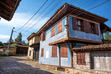 Fototapeta na wymiar Glimpse of houses in the picturesque village of koprivshtitsa in Bulgaria