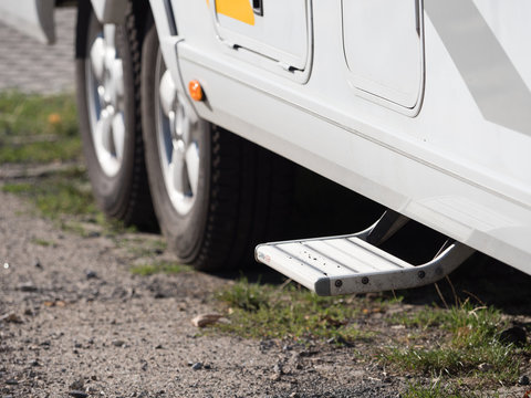 Close view of a motor home electronic step ready to be used to help enter the vehicle - Image.