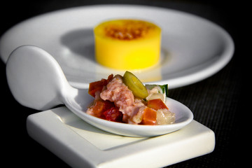 Contemporary Mexican blue fin tuna ceviche served with citrus gelée, plated in an elegant minimal composition of modern gourmet tasting dishes.