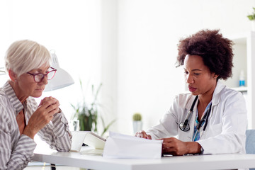 Mature woman at the doctor office come to consult about her health