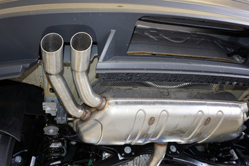 Rear silencer of a modern car. Car maintenance and repair, spare parts for repair. Original quality...