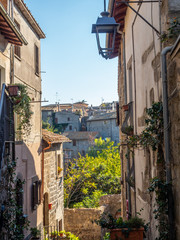 Fototapeta na wymiar old stone houses in narrow streets in the old town of Viterbo, Italy