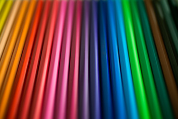 Close up of color pencils as background for design. Crayons background. Abstract multicolor background made with pencils.  