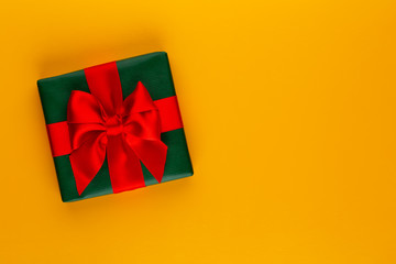 Christmas, holiday present box on red background.