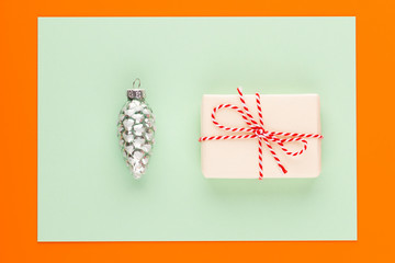 Christmas decor. Christmas decorations on orange background. Flat lay, top view, copy space.