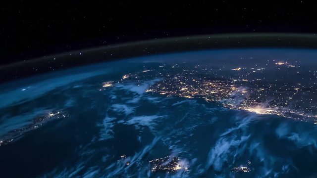Planet earth fast rotating with night lights clouds abd lighting bolt view from space. Contains public domain elements by Nasa