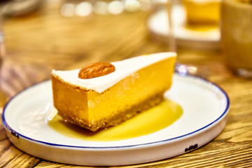 Cheesecake with walnuts on the plate.