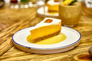 Cheesecake with walnuts on the plate.