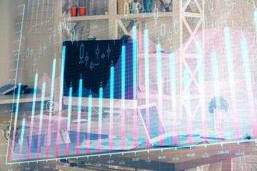 Financial chart drawing and table with computer on background. Multi exposure. Concept of international markets.