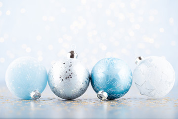 Fototapeta na wymiar Christmas ball background. Greeting card decorations on a blue background.