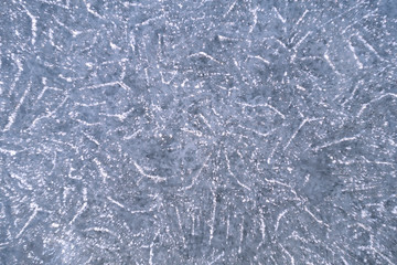 Ice background with natural pattern and tracery. Natural winter texture of frozen water. New Year and Christmas card.