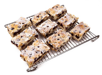 Slice of cherry Crumb cake on a oven shelf