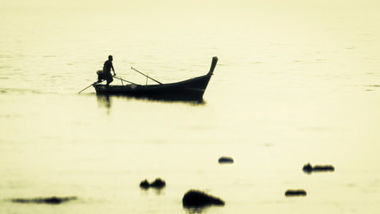 Asian fisherman returning in the evening