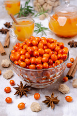 Raw sea buckthorn berries in a glass dish