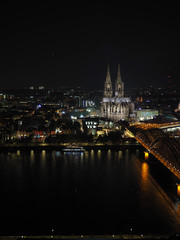 Aerial night view of St Peter Cathedral and Hohenzollern Bridge